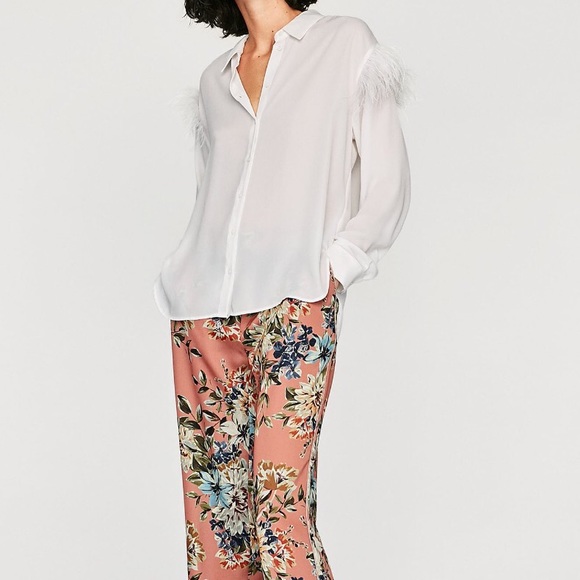 white shirt with feathers